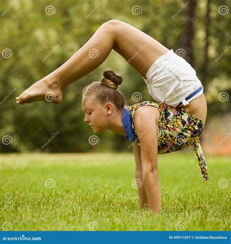 Young Girl Doing Stretching Exercise on Green Stock Image - Image of health, healthy: 45911297