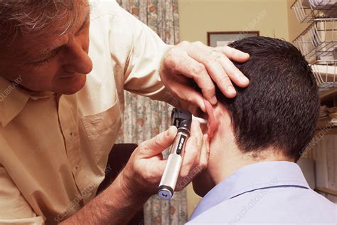 Ear examination - Stock Image - M920/1009 - Science Photo Library