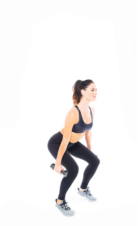 Squat and Shoulder Press Begin with feet shoulder-width apart, and hold a pair of dumbbells by ...