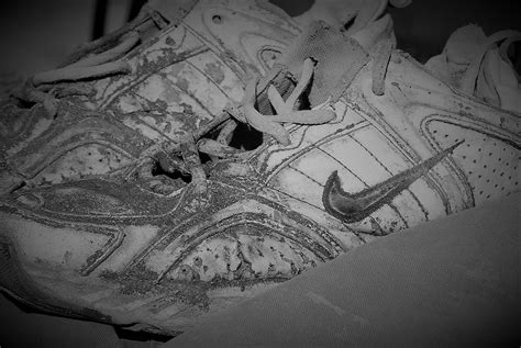 Free stock photo of Old Shoes Black White Worn Nike Running Shoes
