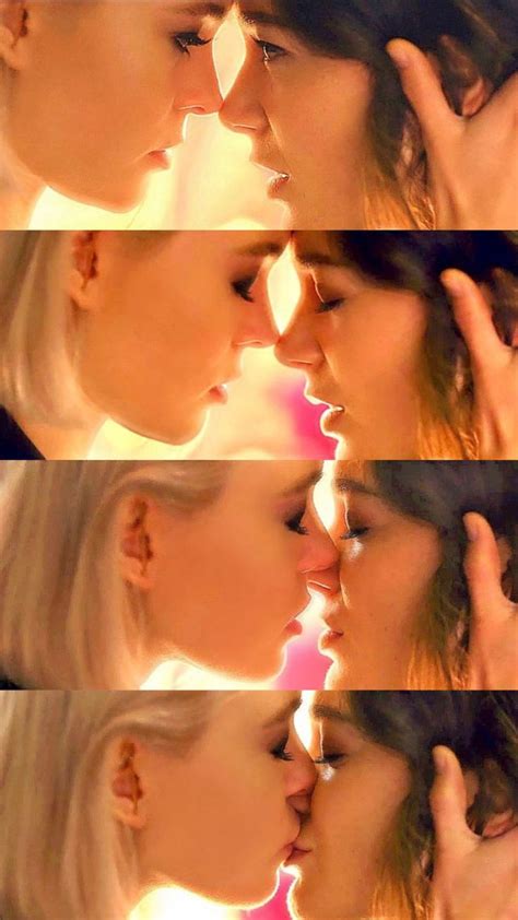 two women kissing each other with their noses touching