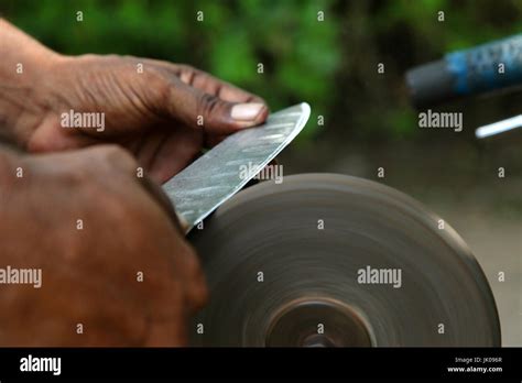 sharpening the knife with whetstone Stock Photo - Alamy