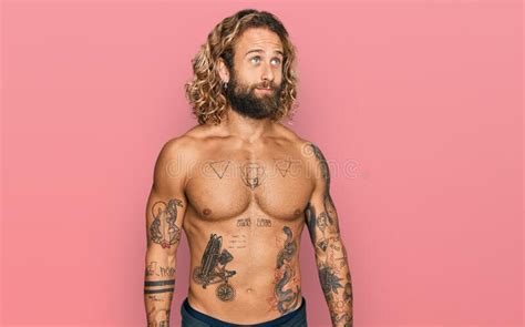 Handsome Man with Beard and Long Hair Standing Shirtless Showing ...