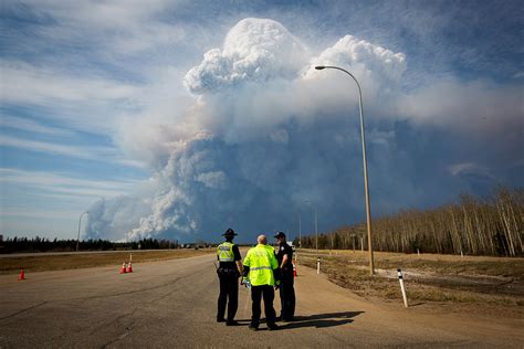 Alberta wildfire moves south, forcing more evacuations in Canada's oil sands
