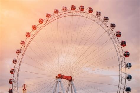 Premium Photo | Ferris wheel in amusement park against sky background ...