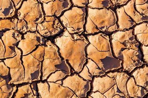 Cracks on the Ground in Orange, Background of a Desert Area with Cracks Stock Image - Image of ...