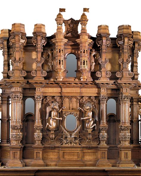 an elaborately carved wooden structure with mirrors on the front and back sides, including statues