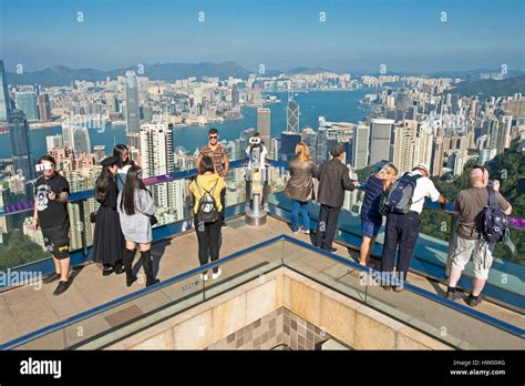 Tourists taking photographs from Sky Terrace 428 on top of the Peak ...