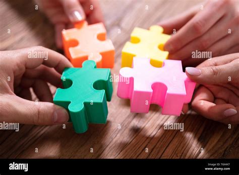 Putting the puzzle together hi-res stock photography and images - Alamy