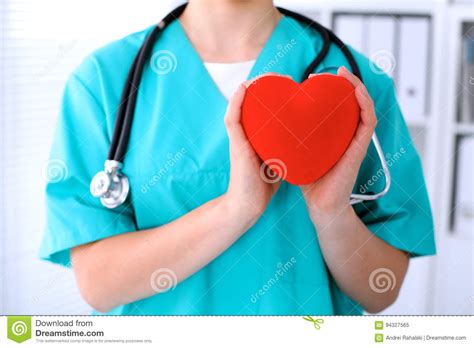 Female Surgeon Doctor with Stethoscope Holding Heart. Stock Image ...