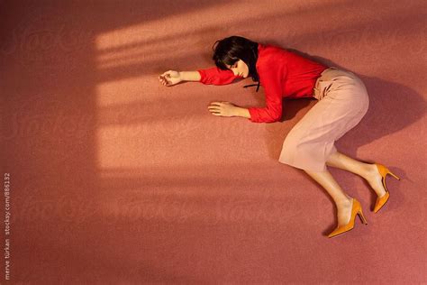 "Woman Lying Down On The Floor Of A Room" by Stocksy Contributor "Ulas&Merve" | Pose reference ...