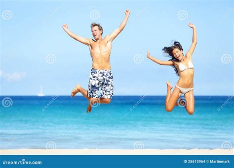 Beach People - Happy Couple Jumping Stock Images - Image: 28613964