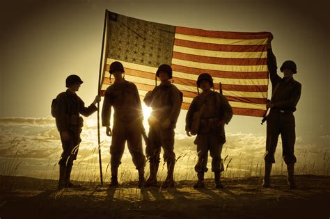 WWII Soldiers Standing In A Flag Draped Sunset - SIlhouette