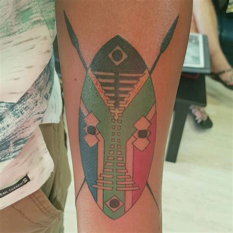 First tattoo, Zulu shield and spears w/ South African flag, by Mitch at Full Moon Tattoo ...