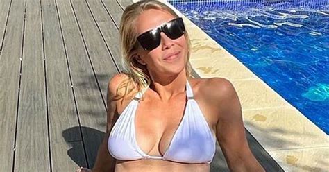 A Place in the Sun's Laura Hamilton stuns in white bikini as she cools ...
