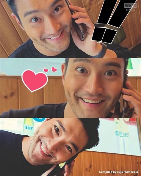 two men smiling and talking on their cell phones, one with a heart sticker above his head