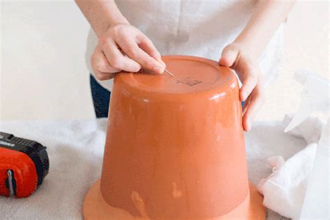How to drill drainage holes in a plant pot made from plastic, ceramic or terra cotta. Tip: Soak ...