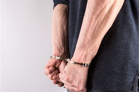 Hands In Handcuffs Free Stock Photo - Public Domain Pictures