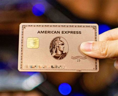 an american express credit card being held up