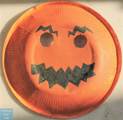 Paper Plate Pumpkin Mask for an Easy Halloween Craft