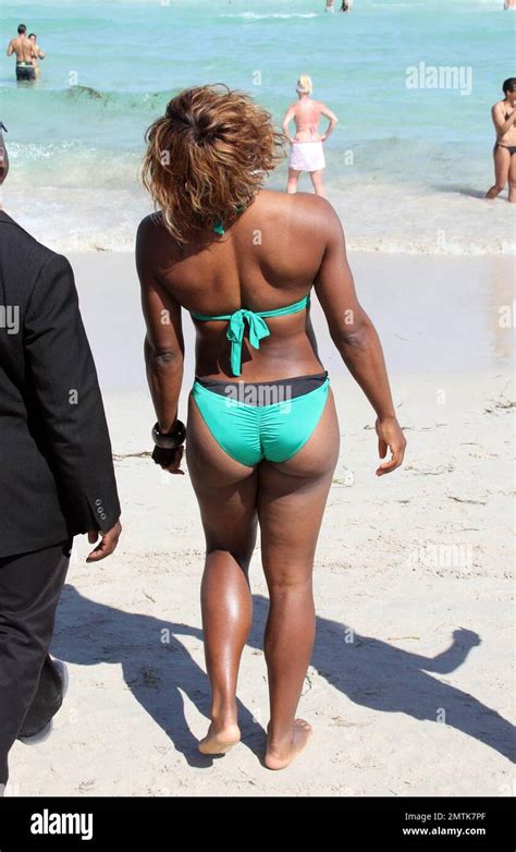 Serena Williams flaunted her figure today in an emerald green bikini ...