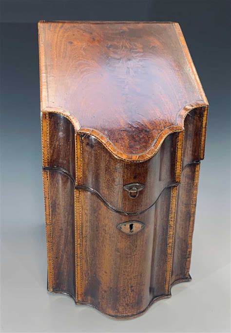 Lot 201 - A George III mahogany knife box, with