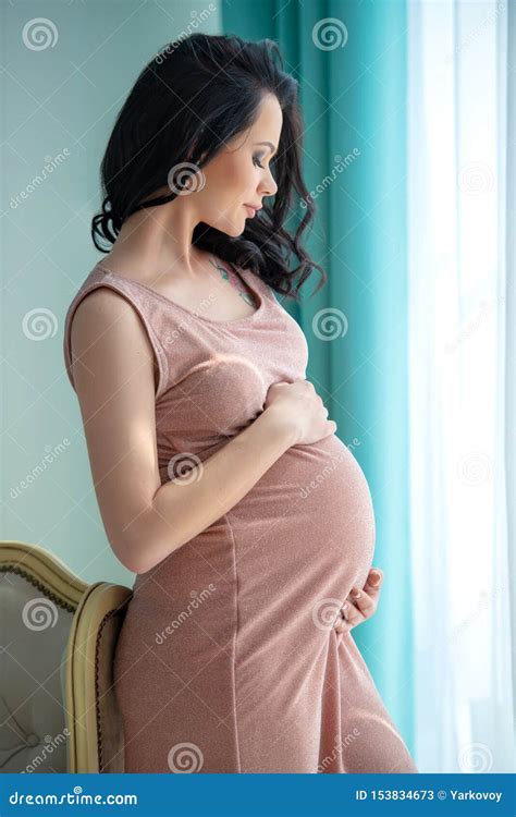 Women`s Health And Pregnancy. Beautiful Pregnant Woman In A Soft Pink ...