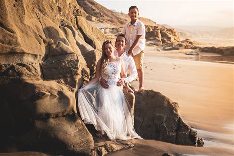 Photograph of a Family on a Rock · Free Stock Photo