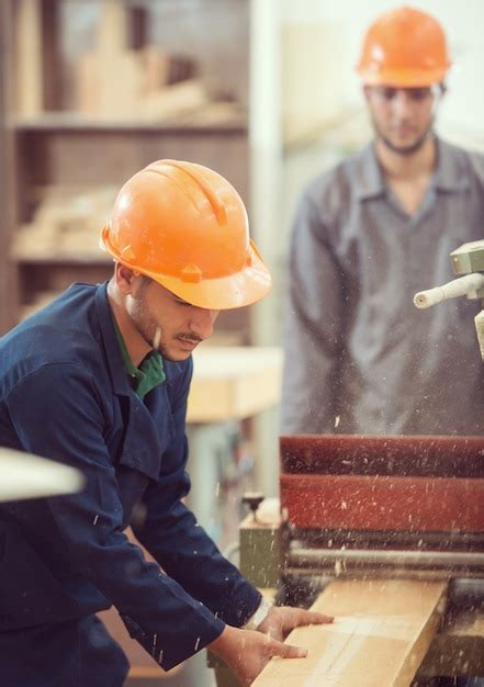 Premium Photo | Workers in industrial cutting wood factory