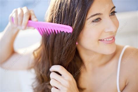 Woman Brushing Hair