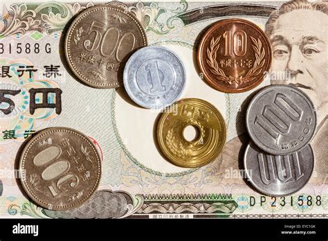 Japanese various value Yen coins on background of Japanese banknotes Stock Photo - Alamy