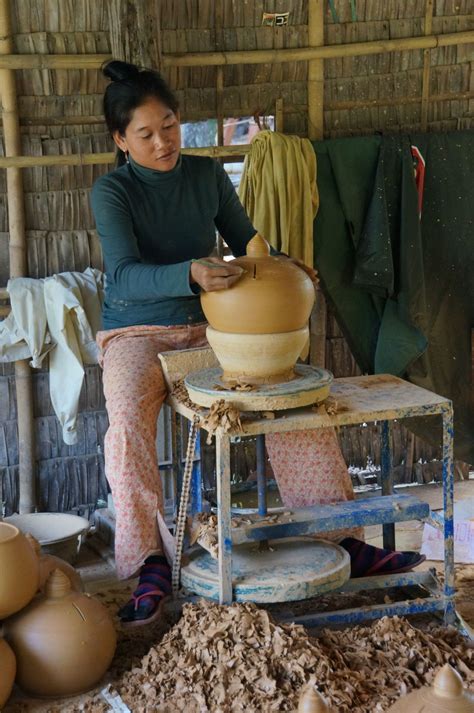 A young Cambodian woman creates a clay pot using a pottery wheel in Kampong Chhnang province ...