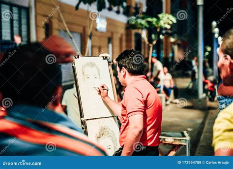 EL SALVADOR - DECEMBER 25: Artist Drawing a Man`s Portrait in the ...