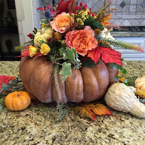 Thanksgiving centerpiece made with a real pumpkin! | Thanksgiving centerpieces, Pumpkin, Table ...