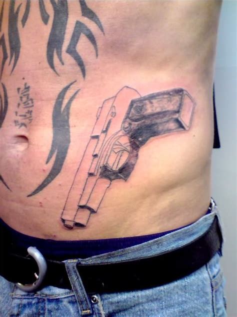 Details more than 74 gun tattoos for men - in.coedo.com.vn