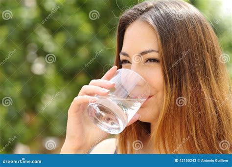 Happy Woman Drinking Water from a Glass Outdoor Stock Image - Image of female, drink: 42150243