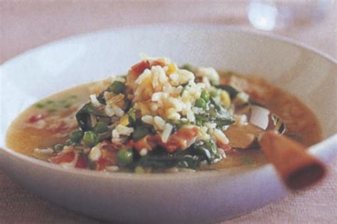 Rice soup with peas and spinach