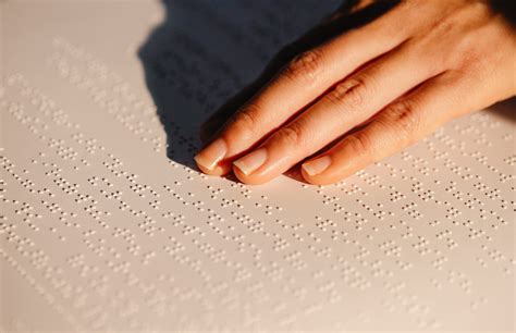 Close-Up Photo Of Person Using Braille · Free Stock Photo