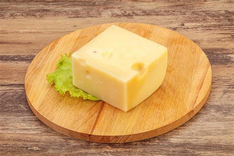 Emmental cheese over wooden board 8584770 Stock Photo at Vecteezy