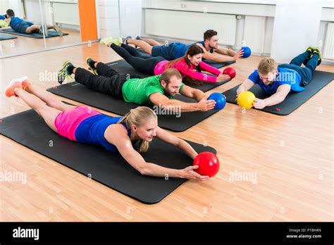 Workout group in gymnasium during physiotherapy Stock Photo - Alamy