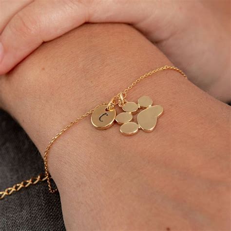 Gold Plated Paw Print And Initial Bracelet By PoppyK | Paw jewelry, Gold paw print, Initial bracelet