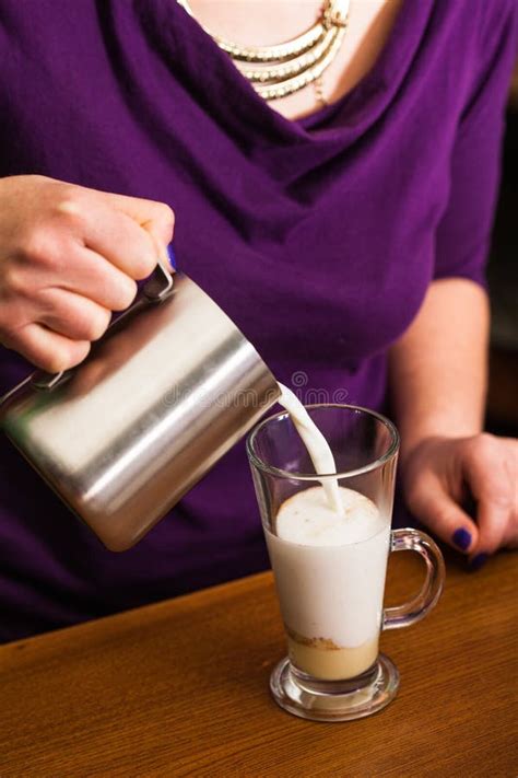 Barista is preparing latte stock photo. Image of saucer - 111431044