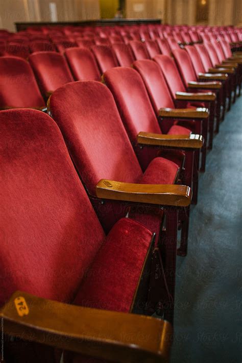 "Theater Seats In Red" by Stocksy Contributor "Raymond Forbes LLC" - Stocksy