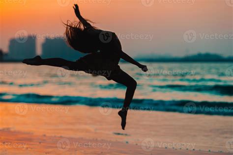 Adorable happy little girl on white beach at sunset. 18056575 Stock Photo at Vecteezy