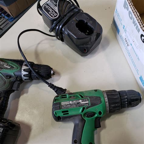 2 HITACHI CORDLESS DRILLS, BATTERIES AND CHARGER - Big Valley Auction