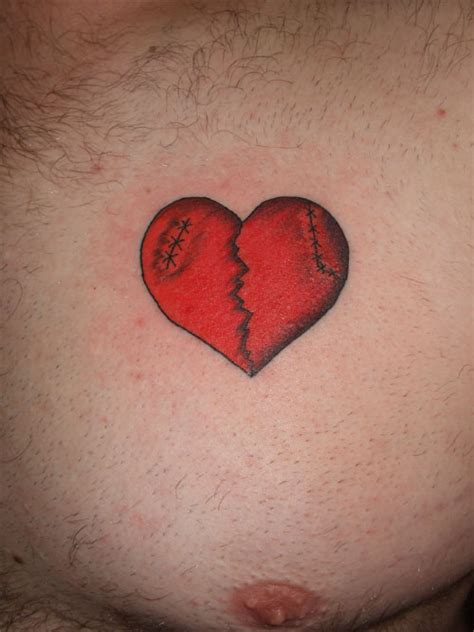Red Broken Heart Tattoo On Chest | Tattoo Designs, Tattoo Pictures