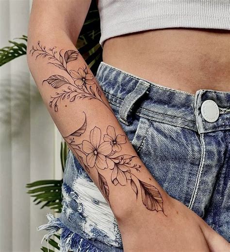 Pin on Tattoos | Around arm tattoo, Forearm tattoo women, Wrap around tattoo