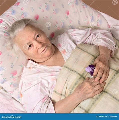 Sick Old Woman Lying At Bed Royalty Free Stock Image - Image: 37911146