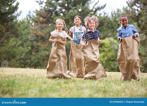 Kids at sack race stock photo. Image of diversity, leisure - 87806602