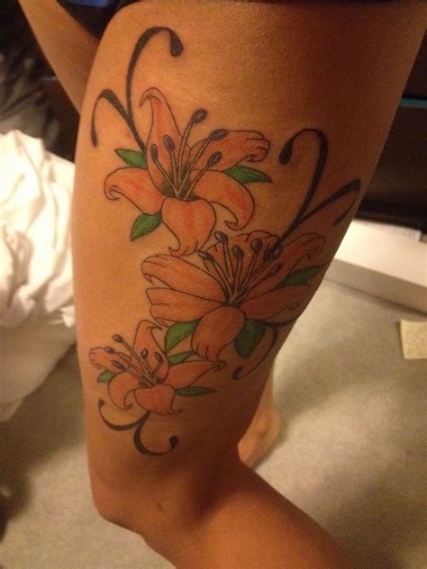 thigh lily tattoo | Lily tattoo, Lily tattoo design, Cancer ribbon tattoos